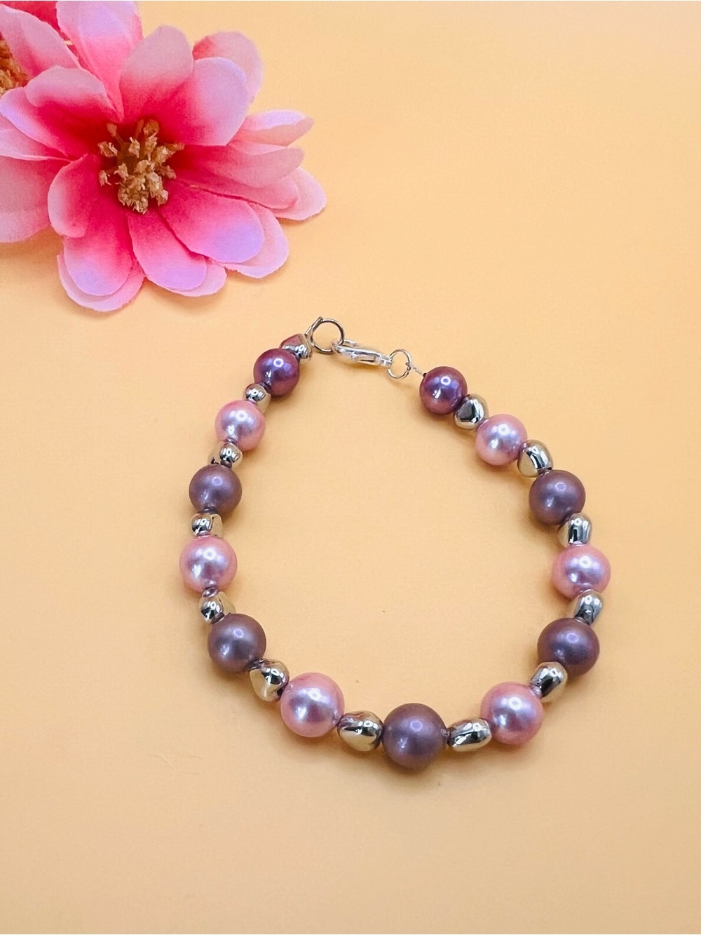 Pink and Mauve Pearl Bracelet with Silver Hearts Accent Beads